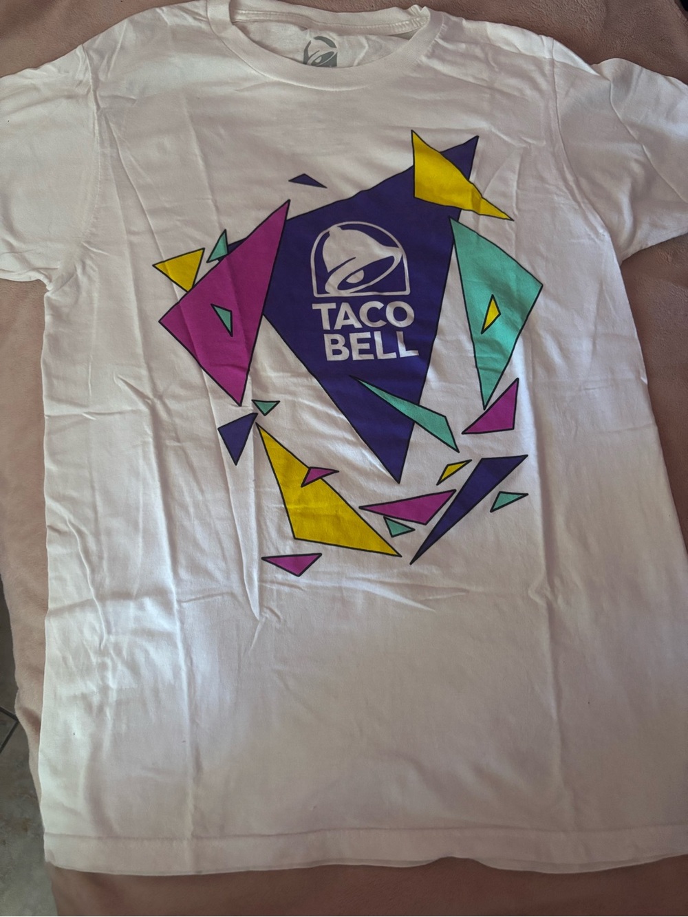 Taco Bell Women's White Graphic Tee with Multi-Color Geometric Print